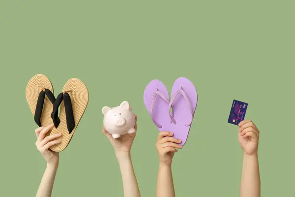 Female Hands Flip Flops Piggy Bank Credit Card Green Background — Stock Photo, Image