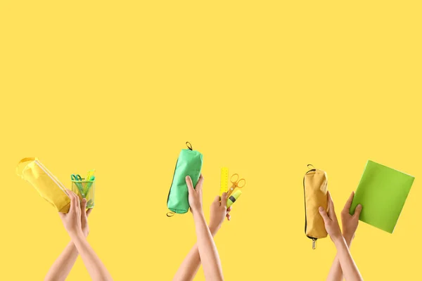 Weibliche Hände Mit Unterschiedlicher Papeterie Auf Gelbem Hintergrund — Stockfoto