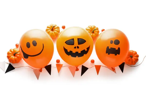 Halloween balloons and decor on white background