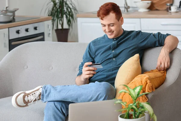 Handsome Young Man Credit Card Modern Laptop Sitting Sofa While — Stock Photo, Image