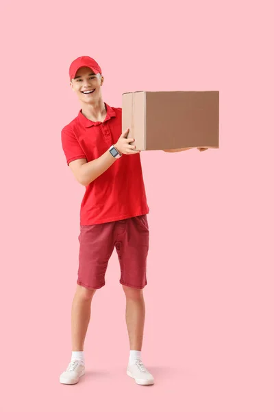Young Courier Parcel Pink Background — Stock Photo, Image