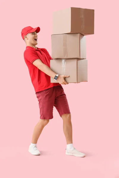Young Courier Parcels Pink Background — Stock Photo, Image