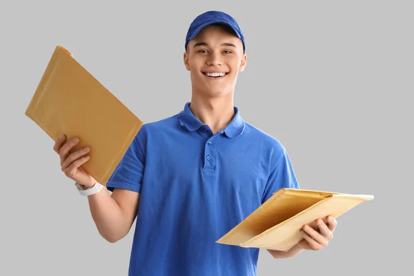 Young Courier Envelopes Light Background — Stock Photo, Image