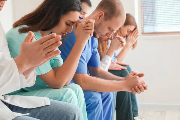 Group Doctors Praying Holy Bible Clinic Closeup — Stok fotoğraf