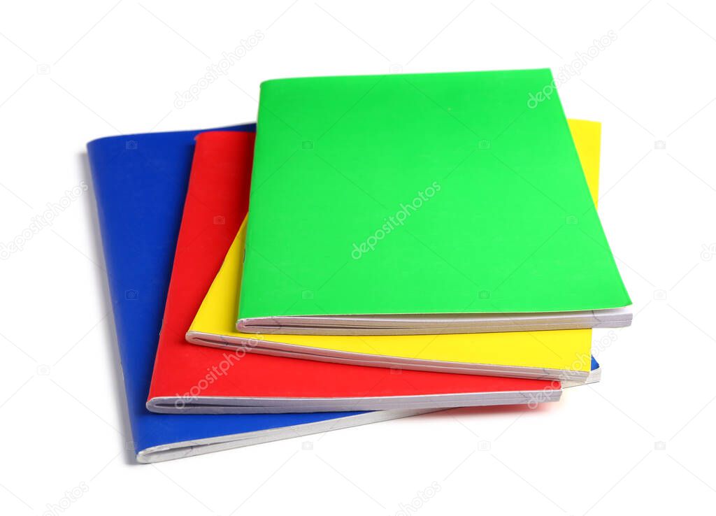Stack of different colorful notebooks isolated on white background