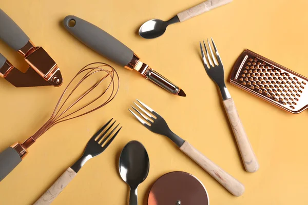 stock image Different kitchen utensils on yellow background