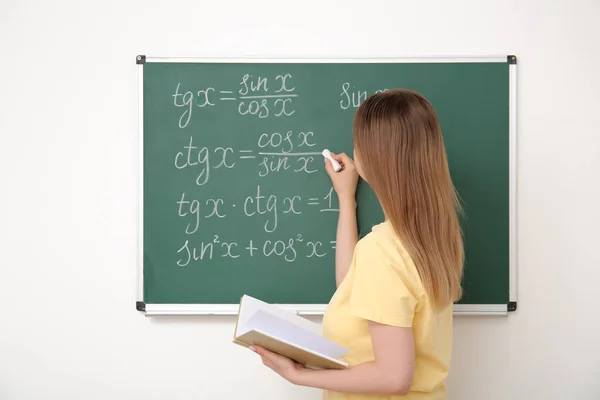 Young Math Teacher Book Writing Blackboard Classroom — Stock Photo, Image