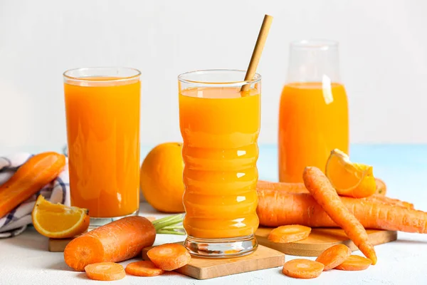 Glasses Bottle Fresh Carrot Juice Light Blue Table — Stock Photo, Image