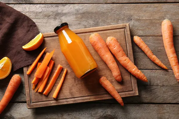 Board Bottle Fresh Carrot Juice Orange Wooden Background — Stock Photo, Image