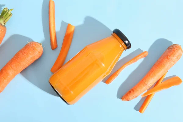 Bottle Fresh Carrot Juice Blue Background — Stock Photo, Image