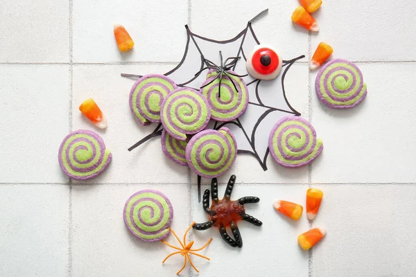 Tasty Cookies Candies Halloween Decorations White Tile Background — Stock Photo, Image