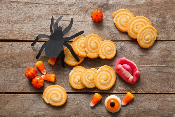 Tasty Cookies Candies Paper Spider Halloween Celebration Brown Wooden Background — Stock Photo, Image