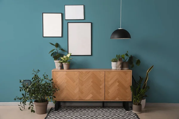 Table Green Houseplants Blank Frames Blue Wall Room — Stock Photo, Image