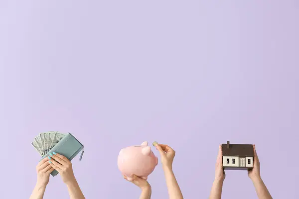 Women Money Piggy Bank House Model Lilac Background — Stock Photo, Image