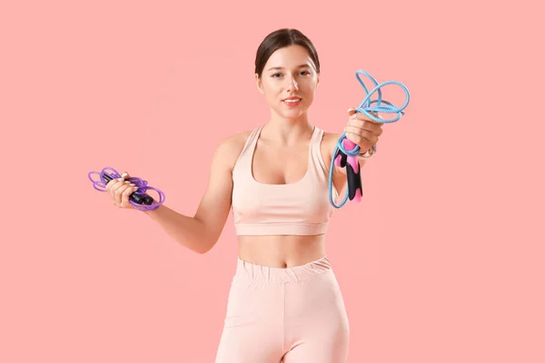 Sporty Young Woman Jumping Ropes Pink Background — Stock Photo, Image