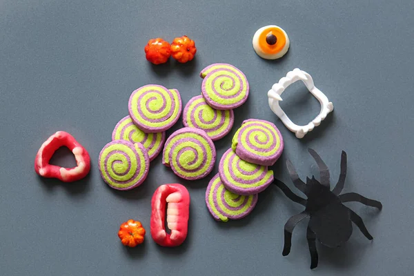 Tasty Cookies Candies Paper Spider Halloween Celebration Grey Background — Stock Photo, Image