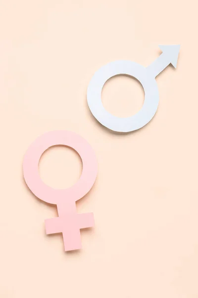 Papieren Symbolen Van Vrouwen Mannen Een Bleke Oranje Achtergrond — Stockfoto