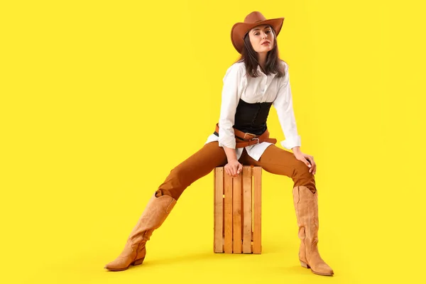 Beautiful Cowgirl Sitting Yellow Background — Stock Photo, Image