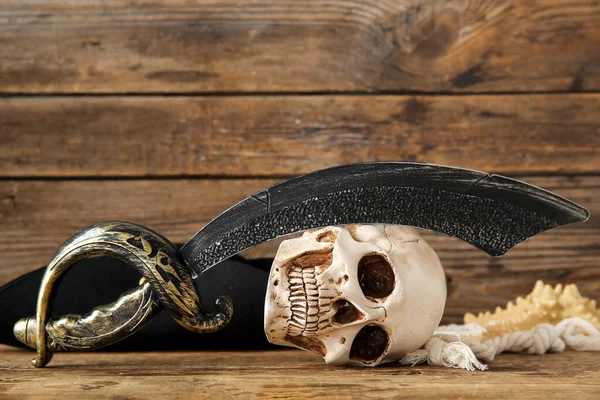 Human Skull Sword Pirate Hat Brown Wooden Background — Stock Photo, Image