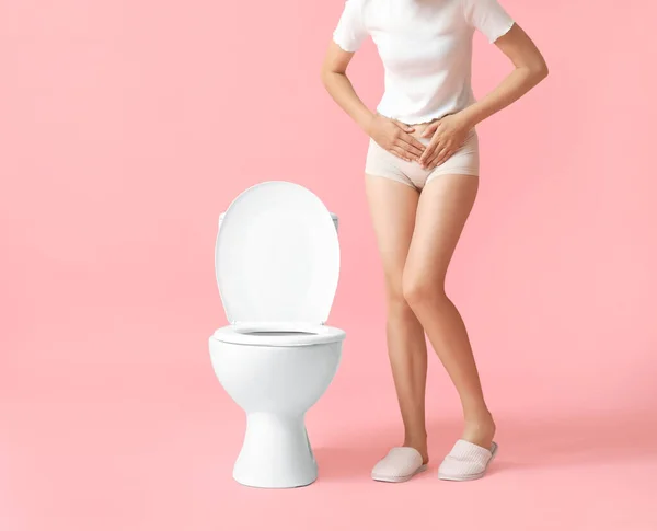 Young Woman Suffering Cystitis Toilet Bowl Pink Background — Stock Photo, Image