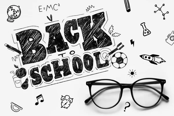 Banner with eyeglasses and text BACK TO SCHOOL on light background
