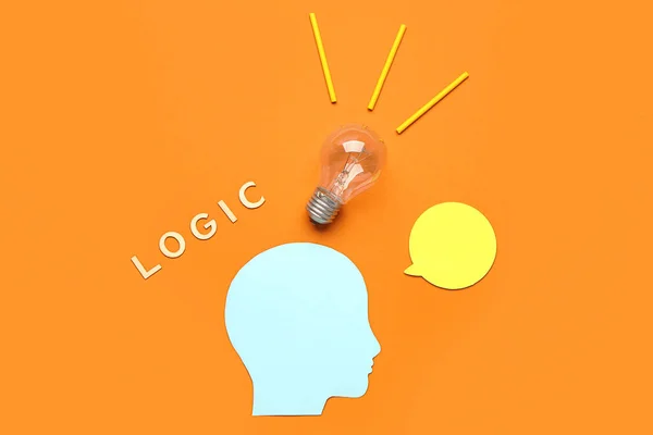 Paper human head with light bulb, speech bubble and word LOGIC on color background