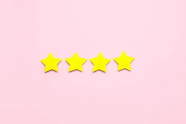 Four stars on pink background. Customer experience concept