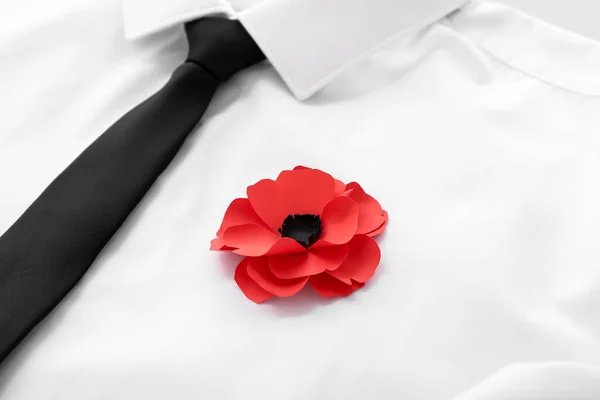 Poppy flower pinned on male clothes. Remembrance Day in Canada