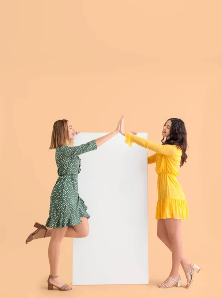 Young Women Dresses Big Blank Poster Giving Each Other High — Stock Photo, Image