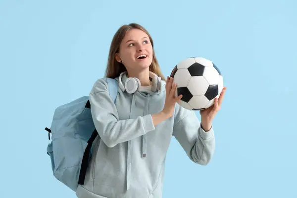 Estudiante Femenina Con Mochila Auriculares Pelota Fútbol Sobre Fondo Azul — Foto de Stock