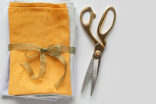 Stack Fabric Tied Ribbon Scissors Light Background — Stock Photo, Image