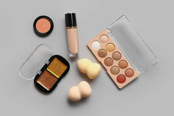 Composition Decorative Cosmetics Makeup Sponges Grey Background — Stock Photo, Image