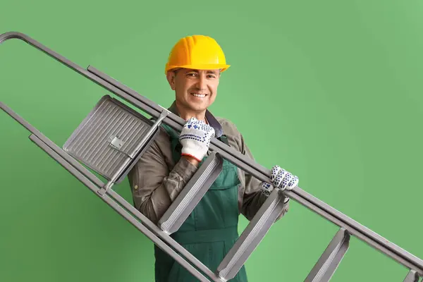 Mature Builder Stepladder Green Background — Stock Photo, Image