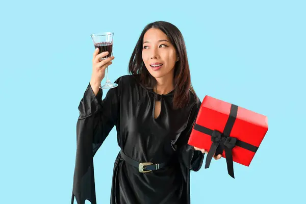 Young Asian Woman Dressed Witch Drink Halloween Gift Blue Background — Stock Photo, Image