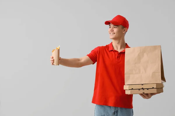 Young Delivery Man French Fries Pizza Light Background — Stock Photo, Image
