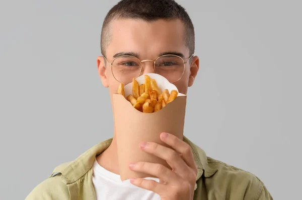 Young Man French Fries Light Background Closeup — Stock Photo, Image