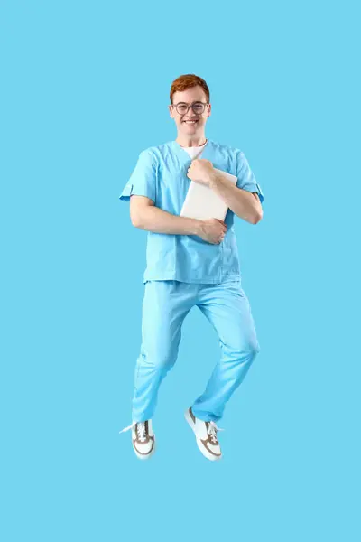 Jumping Male Nurse Blue Background — Stock Photo, Image