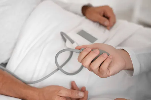 Male Nurse Measuring Blood Pressure Senior Man Bedroom Closeup — Stock Photo, Image
