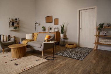 Interior of modern living room with sofa and armchair