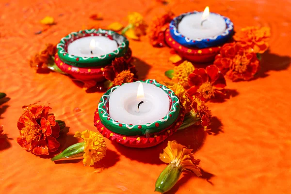 Burning Candles Beautiful Marigold Flowers Water Orange Background Divaly Celebration — Stock Photo, Image