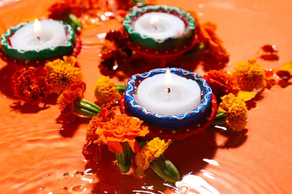 Burning Candles Beautiful Marigold Flowers Water Orange Background Divaly Celebration — Stock Photo, Image