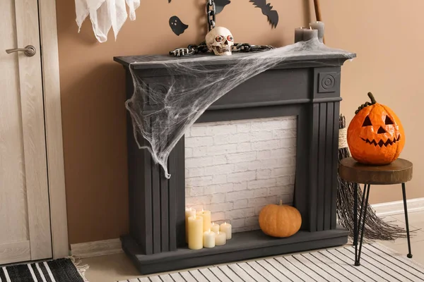Mantelpiece with Halloween decor in hall