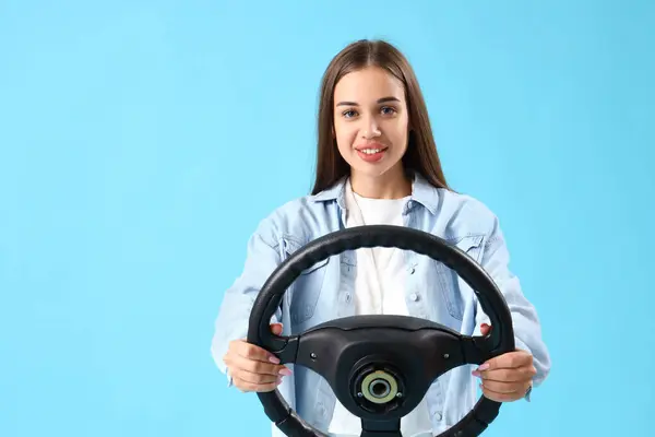Young Woman Steering Wheel Blue Background — Stock Photo, Image