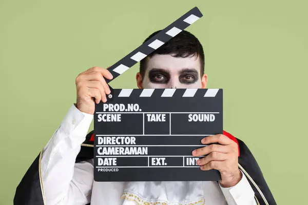 Handsome Young Man Dressed Halloween Vampire Clapperboard Green Background — Stock Photo, Image