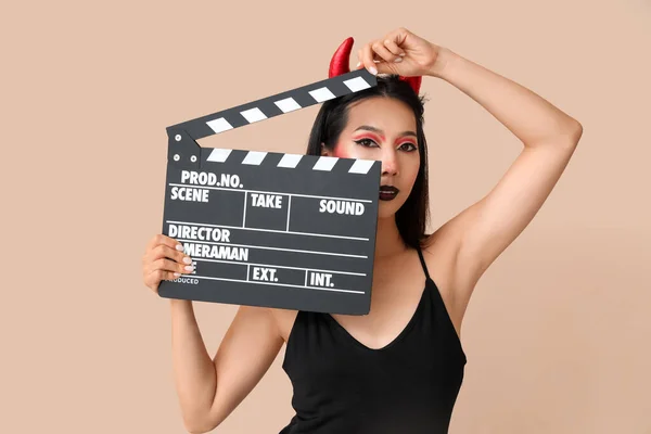 Beautiful Young Asian Woman Dressed Halloween Devil Clapperboard Beige Background — Stock Photo, Image