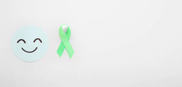 Paper Smiling Face Green Awareness Ribbon Light Background Space Text — Stock Photo, Image