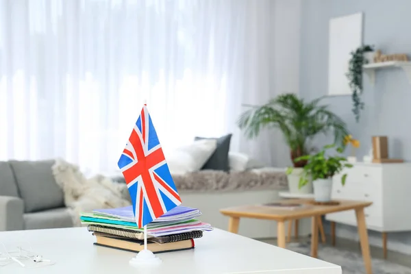 UK flag with books on table in office