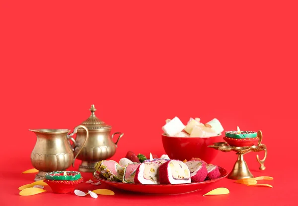 Diya Lamps Candles Plates Different Treats Red Background Divaly Celebration — Stock Photo, Image
