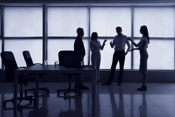 Silhouette of business consultants working in office