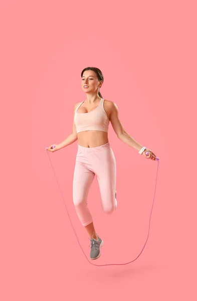 Sporty Young Woman Jumping Rope Pink Background — Stock Photo, Image